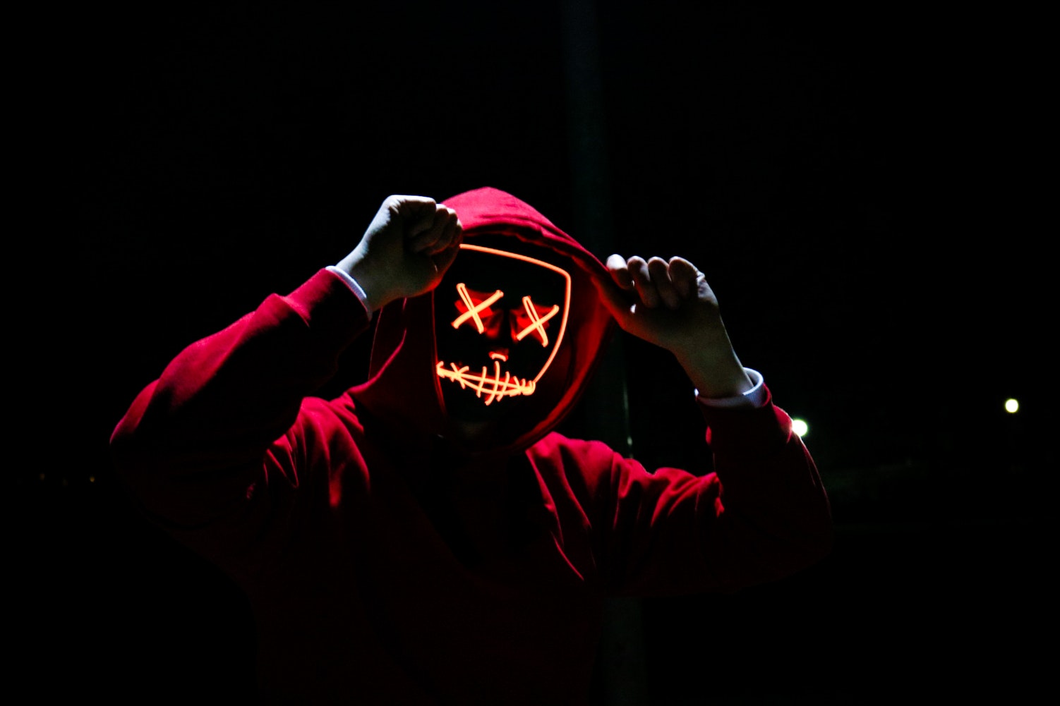 man in glowing red mask